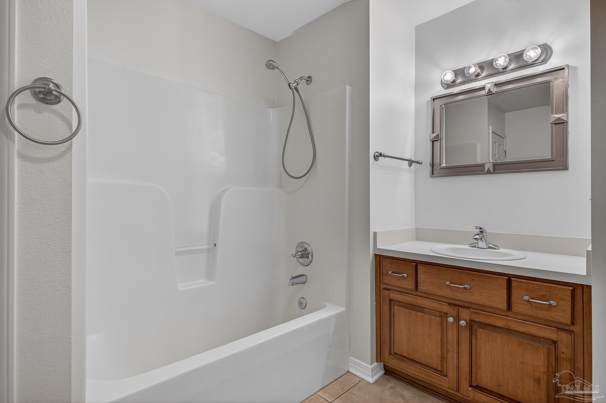 6050 Antelope Street Milton, FL 32570 - Photo 29 of 58 a bathroom with a granite countertop sink a toilet and shower