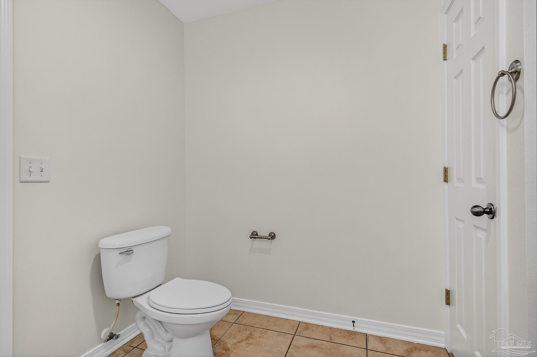 6050 Antelope Street Milton, FL 32570 - Photo 31 of 58 a white toilet sitting next to a shower