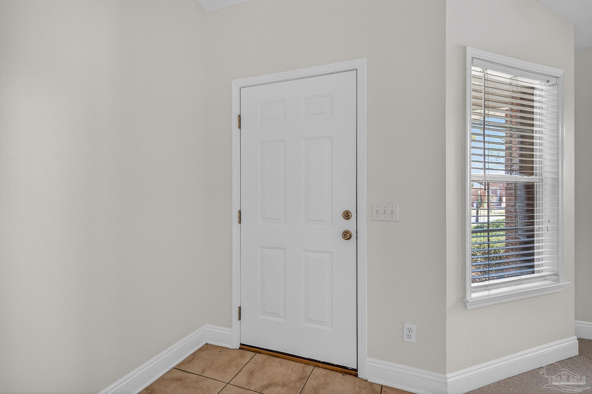 6050 Antelope Street Milton, FL 32570 - Photo 4 of 58 a view of an empty room with a window
