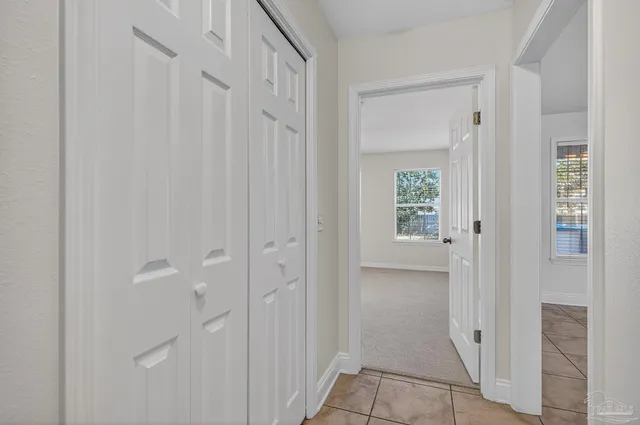 a bathroom with a granite countertop toilet a sink and mirror