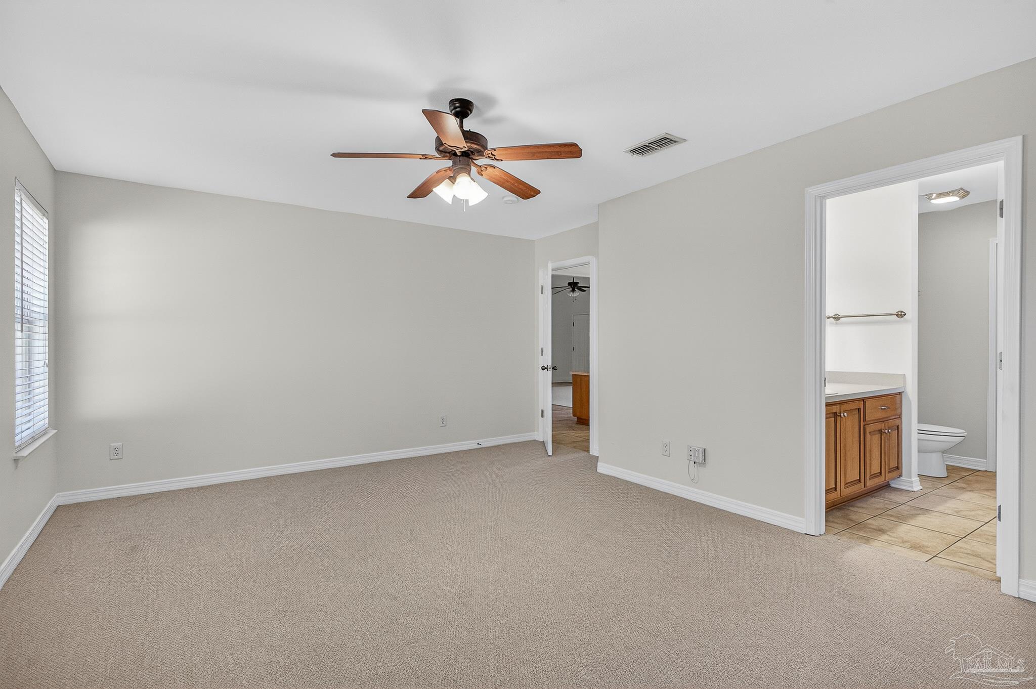 6050 Antelope Street Milton, FL 32570 - Photo 46 of 58 an empty room with closet and windows