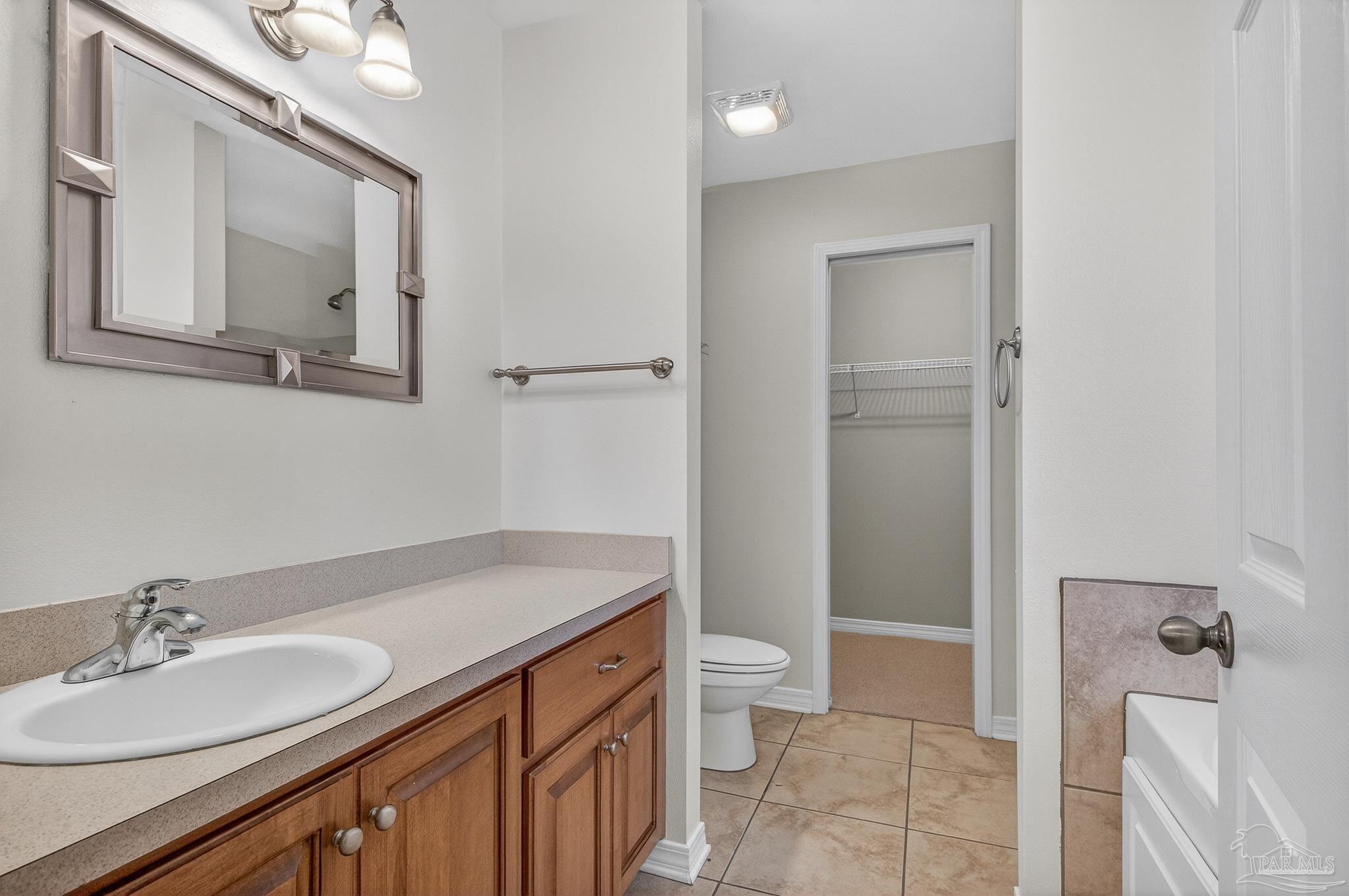6050 Antelope Street Milton, FL 32570 - Photo 47 of 58 a bathroom with a sink a toilet and shower