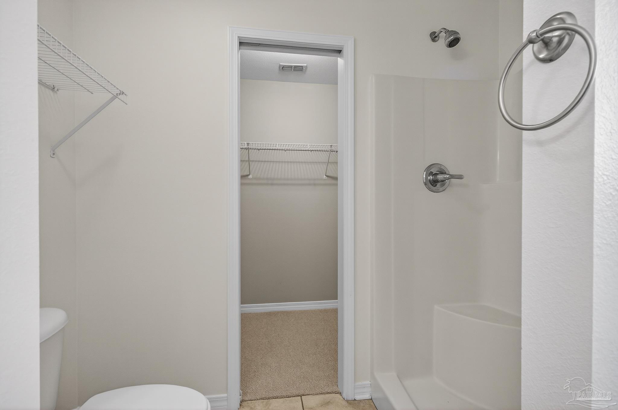 6050 Antelope Street Milton, FL 32570 - Photo 48 of 58 a bathroom with a granite countertop toilet a sink and mirror