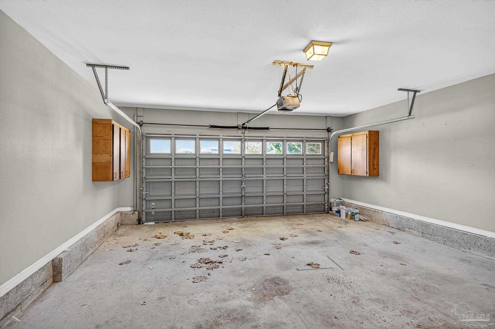 6050 Antelope Street Milton, FL 32570 - Photo 53 of 58 a view of wooden floor and windows in a room
