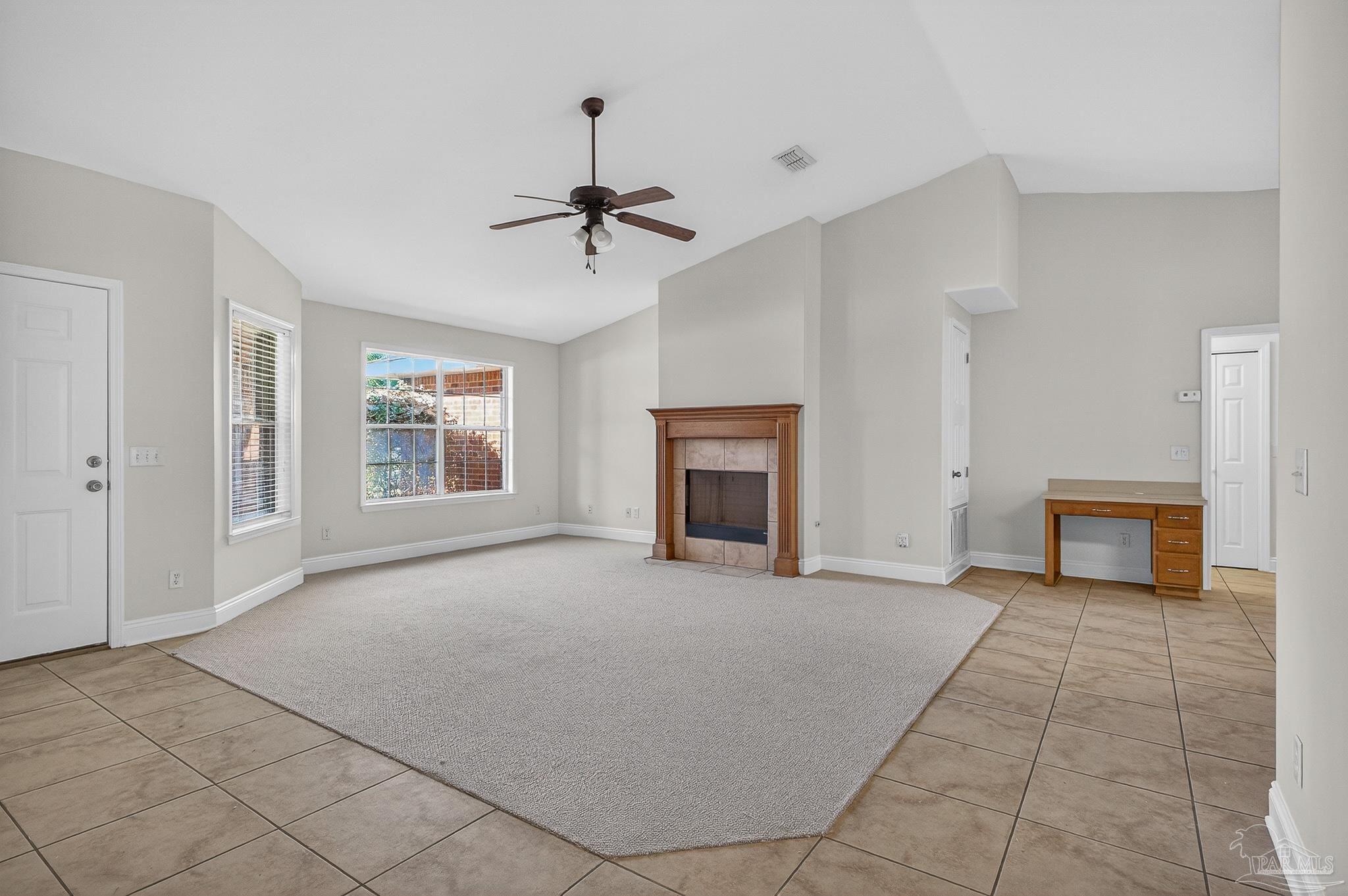 6050 Antelope Street Milton, FL 32570 - Photo 10 of 58 a view of an empty room with a fireplace and a window