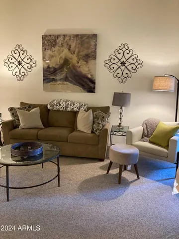 a living room with furniture and a couch