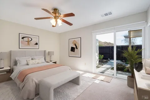 a bedroom with a large bed and a window
