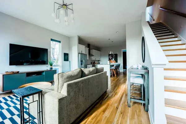a living room with furniture and a flat screen tv