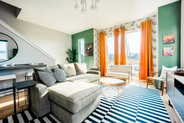 a living room with furniture and a large window
