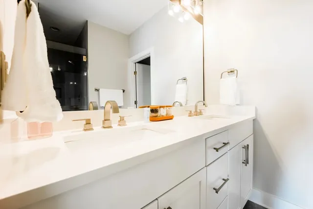 a bedroom with furniture and a large window