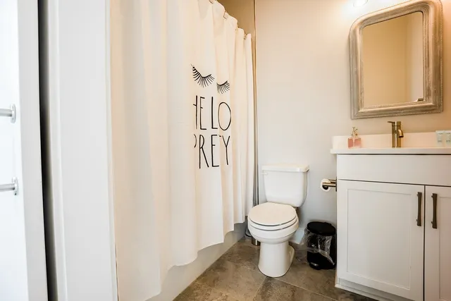 a view of a patio with table and chairs with wooden floor and fence