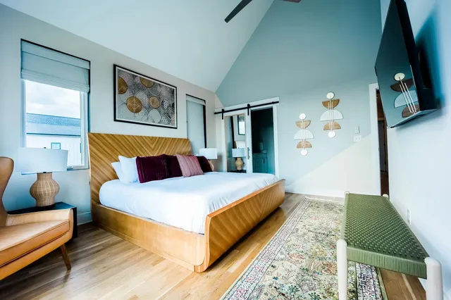 a bedroom with bed and a couch