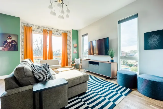 a bedroom with a bed and a television