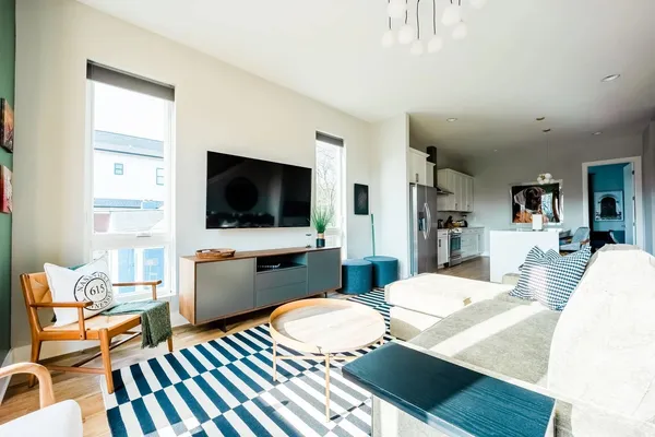 a living room with furniture and a flat screen tv