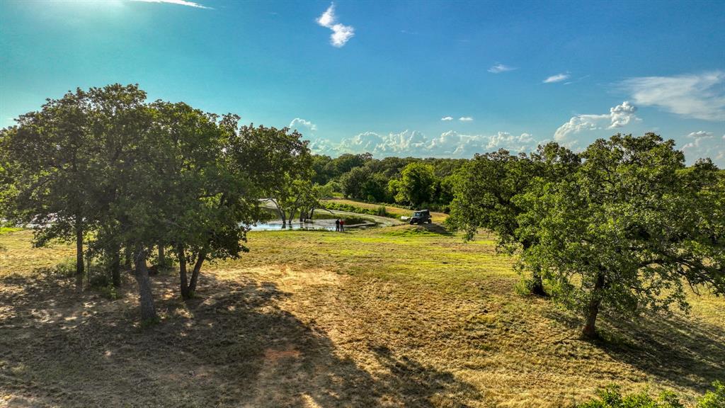 1140 Garvey Ranch Road Loving, TX 76460 - Photo 35 of 40 a view of a lake with a big yard