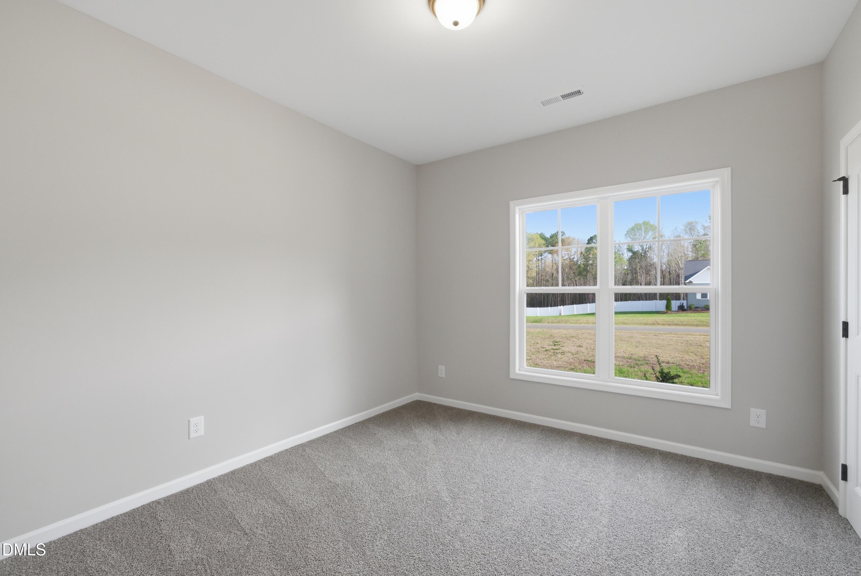 9315 Turkey Way Middlesex, NC 27557 - Photo 23 of 34 an empty room with windows