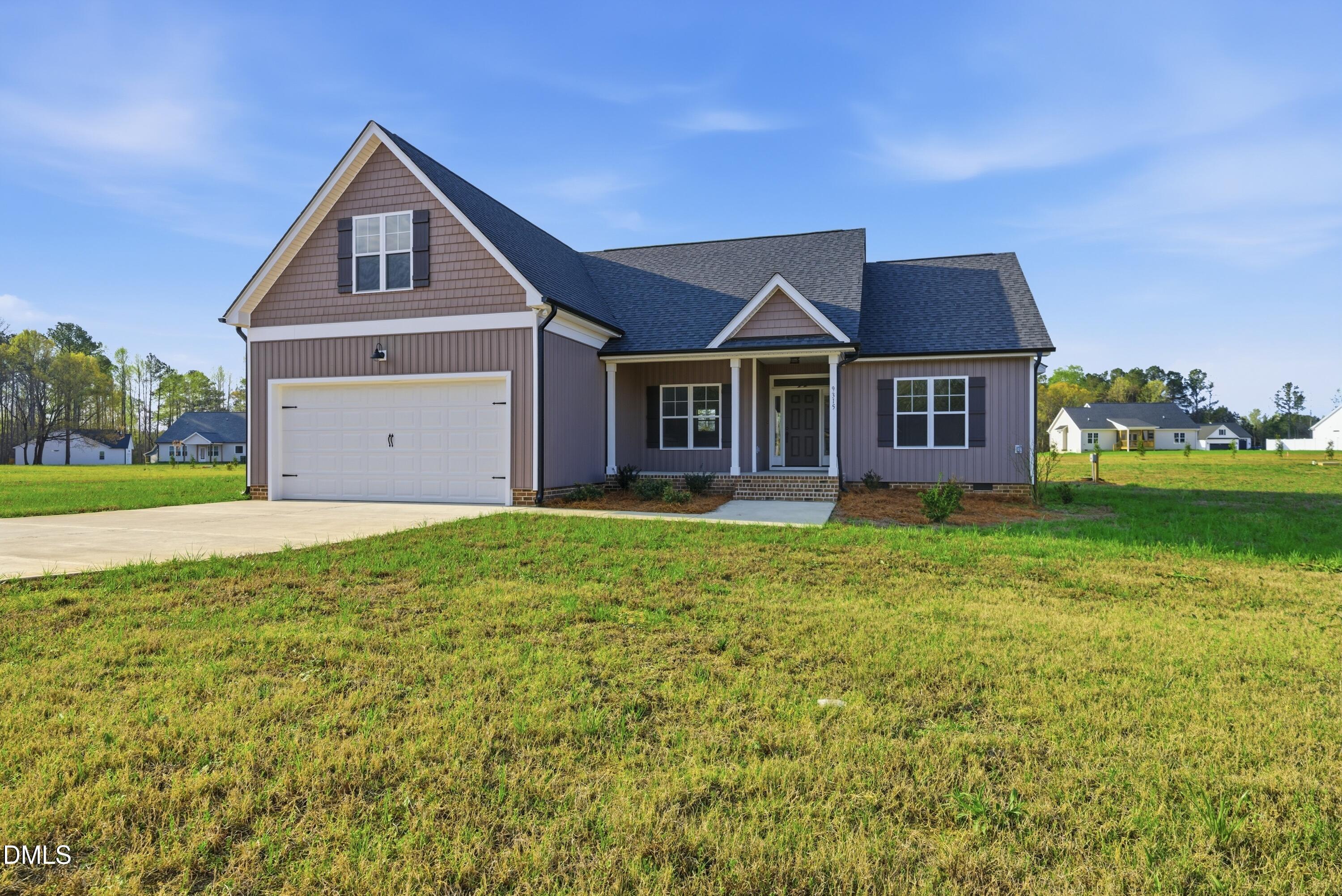 9315 Turkey Way Middlesex, NC 27557 - Photo 27 of 34 a front view of a house with a garden