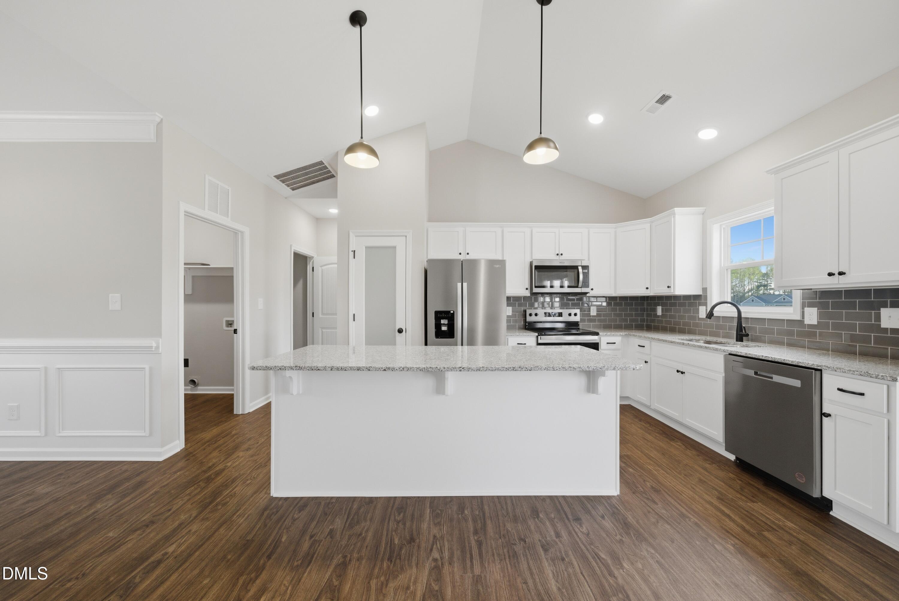 9315 Turkey Way Middlesex, NC 27557 - Photo 3 of 34 a large kitchen with cabinets and wooden floor