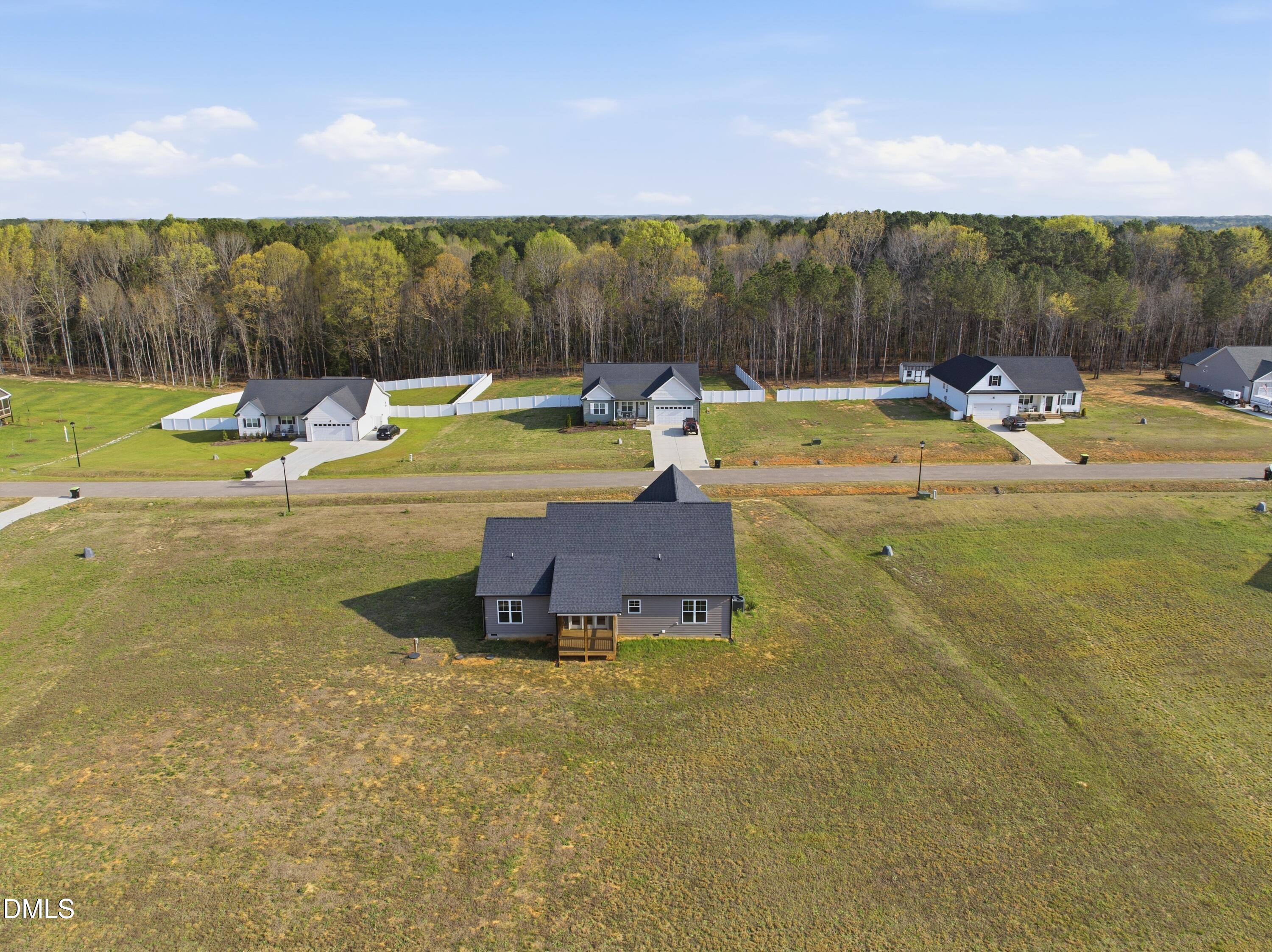 9315 Turkey Way Middlesex, NC 27557 - Photo 31 of 34 a view of a swimming pool with a patio and a yard