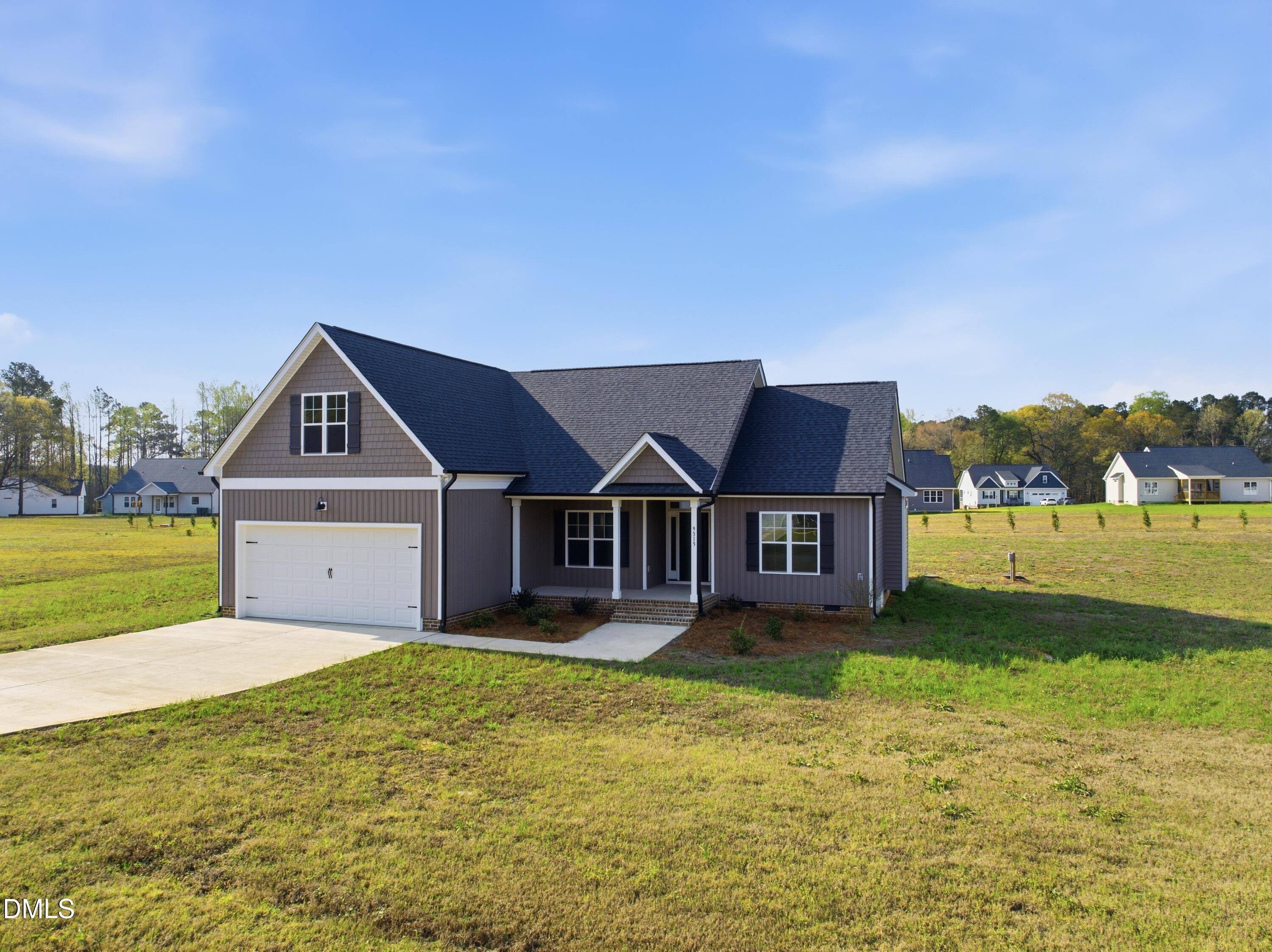 9315 Turkey Way Middlesex, NC 27557 - Photo 32 of 34 a front view of a house with yard and green space