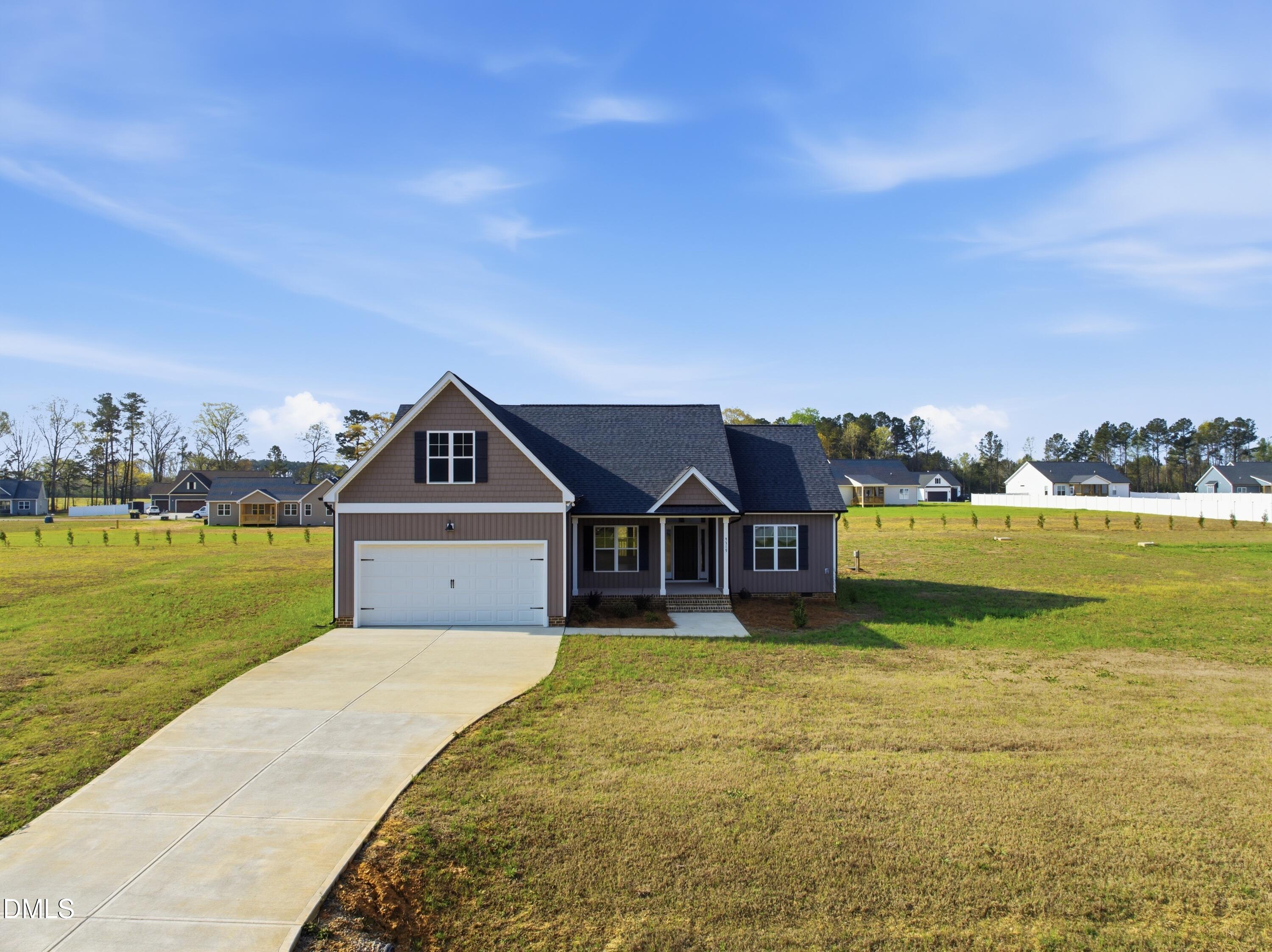 9315 Turkey Way Middlesex, NC 27557 - Photo 33 of 34 a front view of a house with a yard