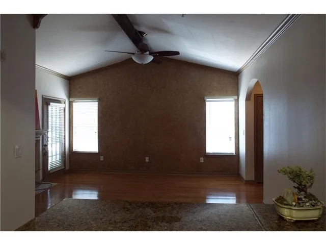 a view of interior and hall with wooden floor