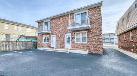 a view of a brick buildings with entryway doors