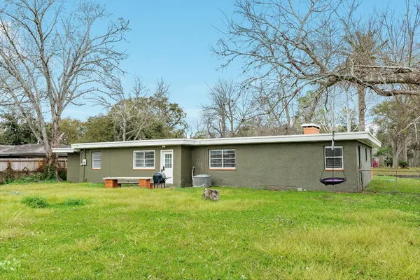 a front view of house with yard and outdoor seating