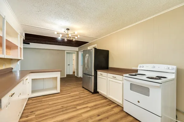 a kitchen with a stove and a microwave