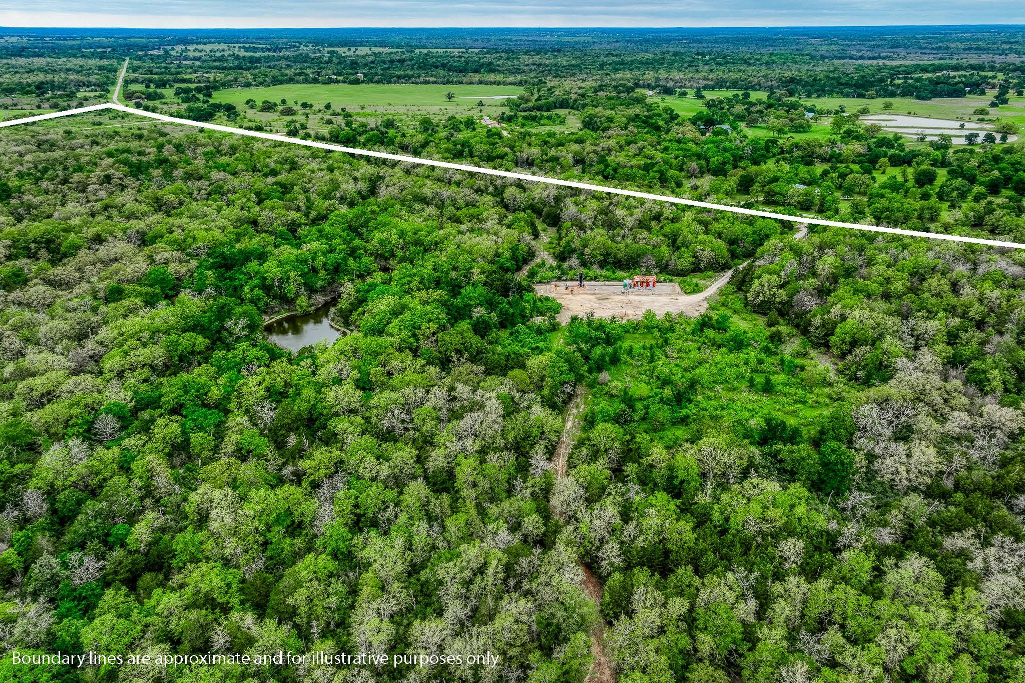 125 Ledbetter Tx 78946 Ledbetter, TX 78946 - Photo 43 of 50 a view of a yard with a forest