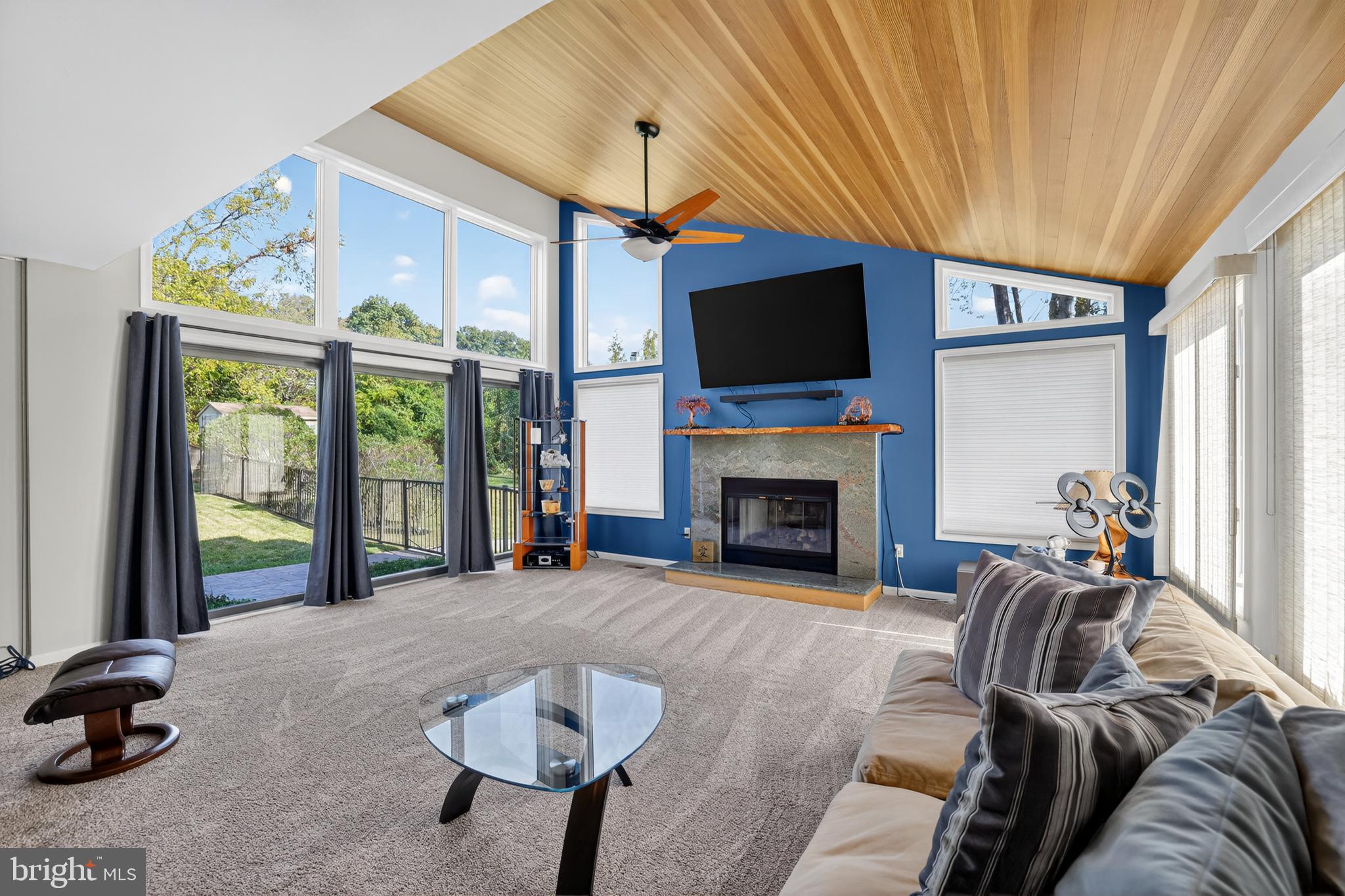 301 Windy Run Road Doylestown, PA 18901 - Photo 14 of 51 a living room with furniture a fireplace and a flat screen tv