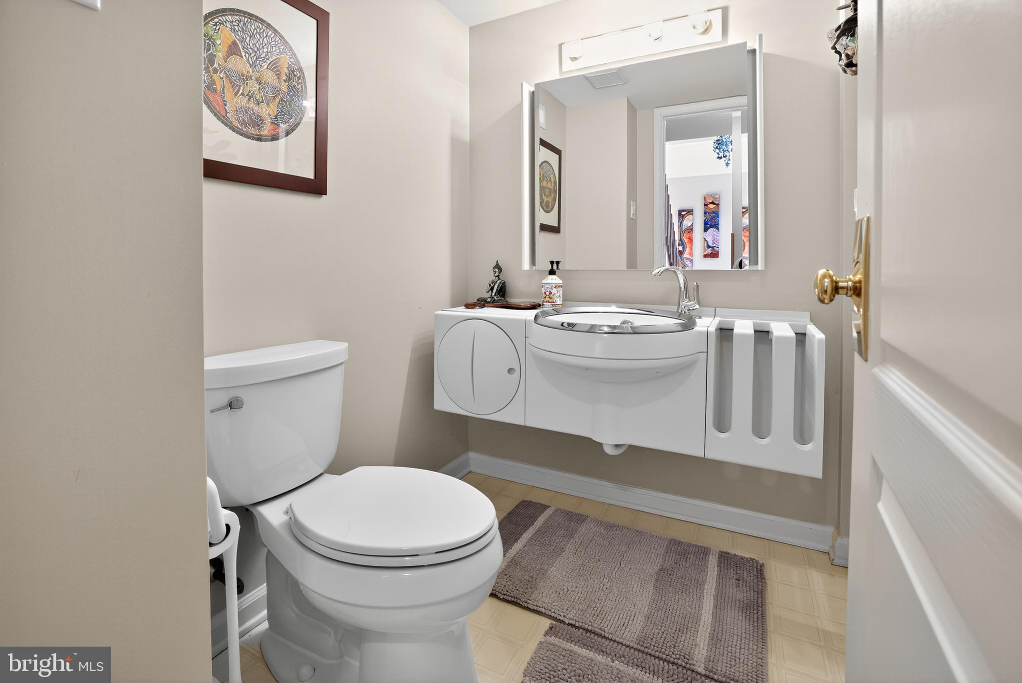 301 Windy Run Road Doylestown, PA 18901 - Photo 16 of 51 a bathroom with a toilet a sink and mirror