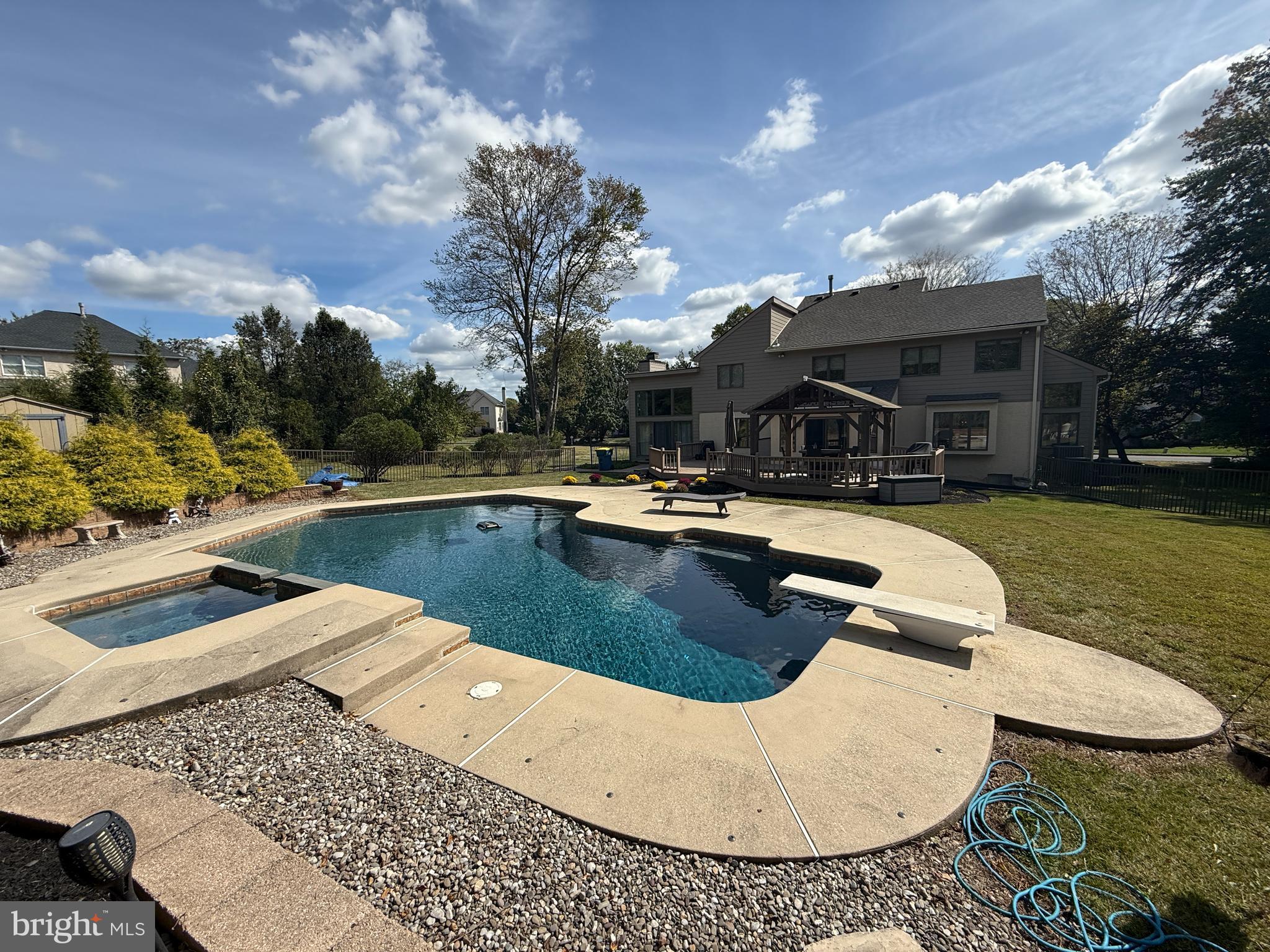 301 Windy Run Road Doylestown, PA 18901 - Photo 22 of 51 a view of a swimming pool with lounge chair