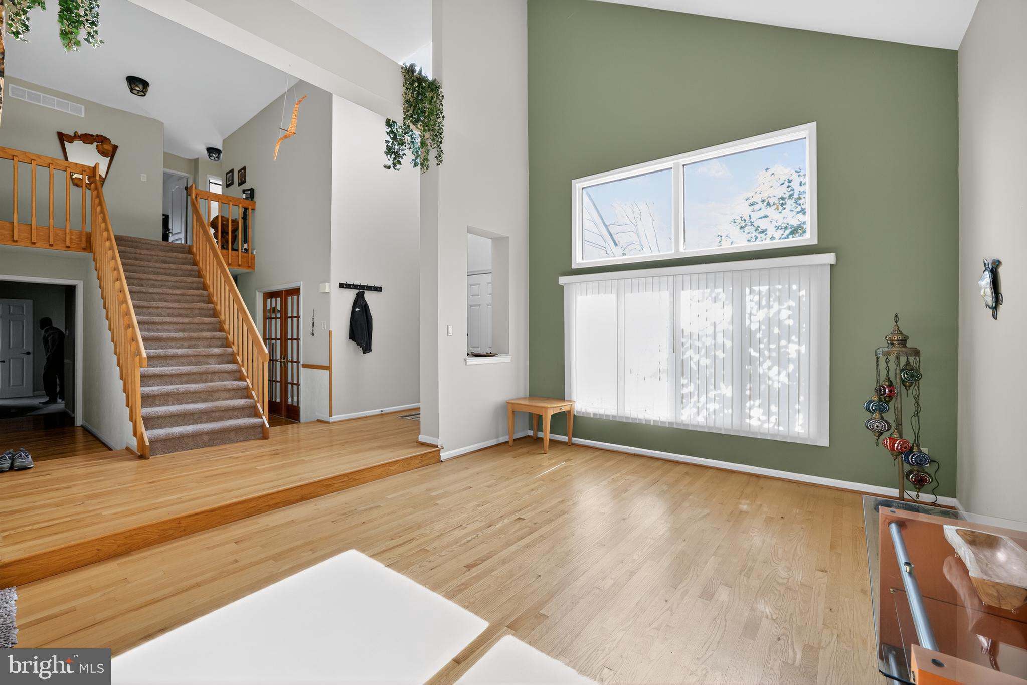 301 Windy Run Road Doylestown, PA 18901 - Photo 7 of 51 a view of an empty room with a window and wooden floor