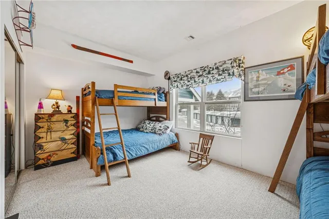 a bedroom with furniture and a window