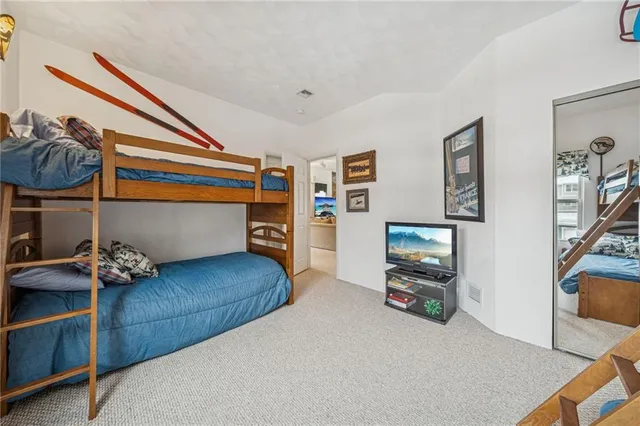 a bedroom with furniture and a wooden floor