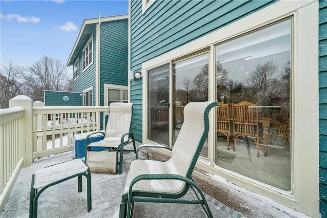 a view of a chairs and table in the balcony