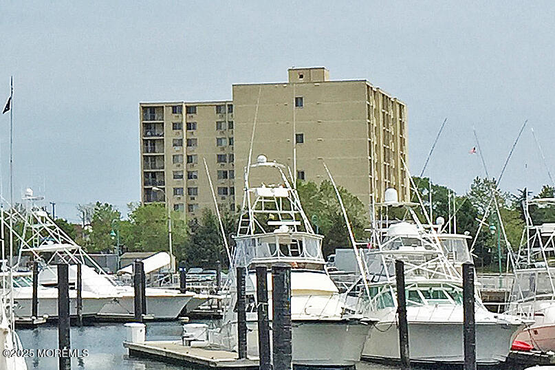 1000 River Road, Unit 2K Belmar, NJ 07719 - Photo 15 of 25 a view of building with yard and staircase