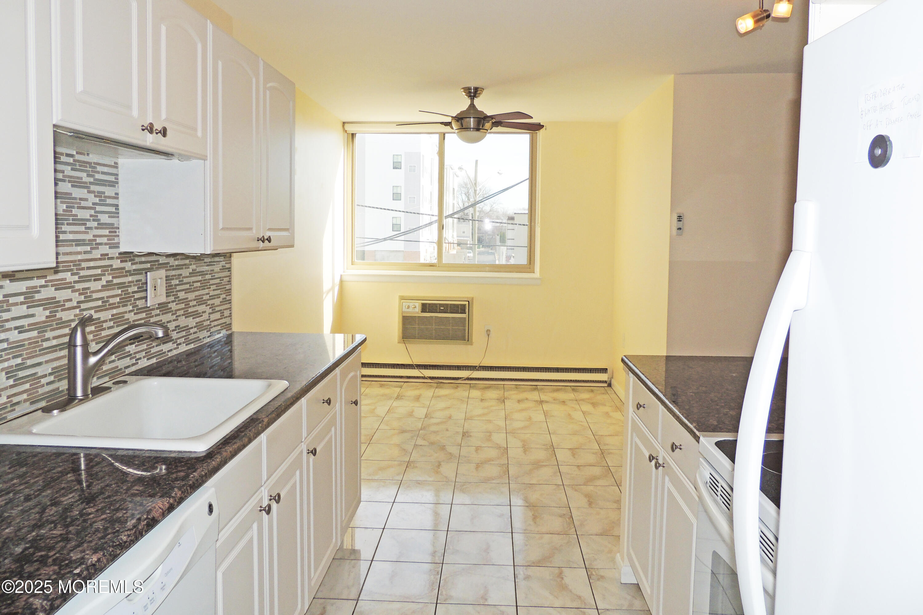 1000 River Road, Unit 2K Belmar, NJ 07719 - Photo 18 of 25 a bathroom with a granite countertop sink a mirror and a bathtub