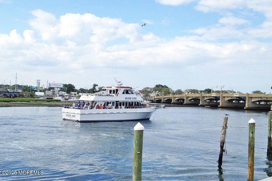 1000 River Road, Unit 2K Belmar, NJ 07719 - Photo 20 of 25 a view of a terrace with lawn chairs