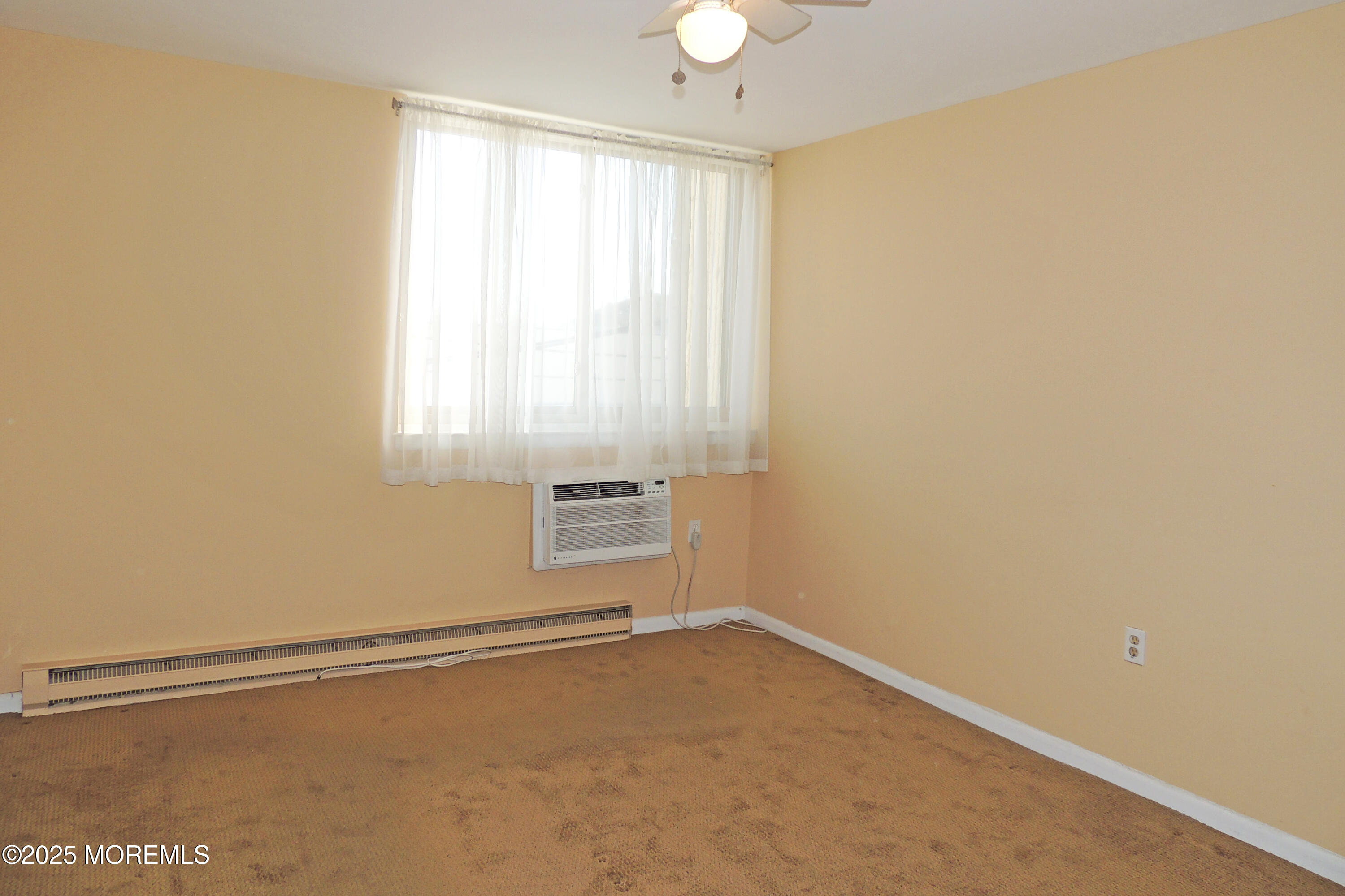 1000 River Road, Unit 2K Belmar, NJ 07719 - Photo 4 of 25 an empty room with a window