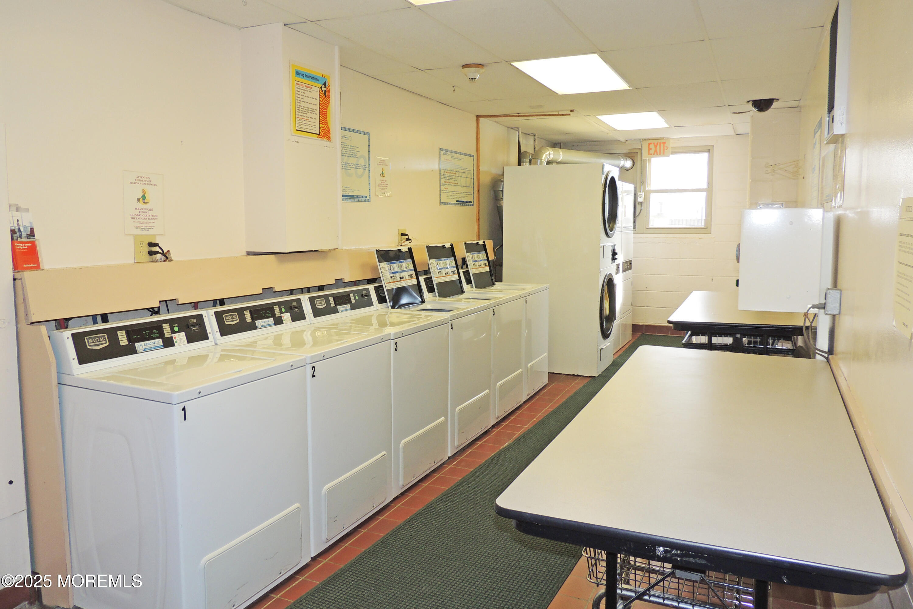 1000 River Road, Unit 2K Belmar, NJ 07719 - Photo 8 of 25 a kitchen with a sink appliances and cabinets