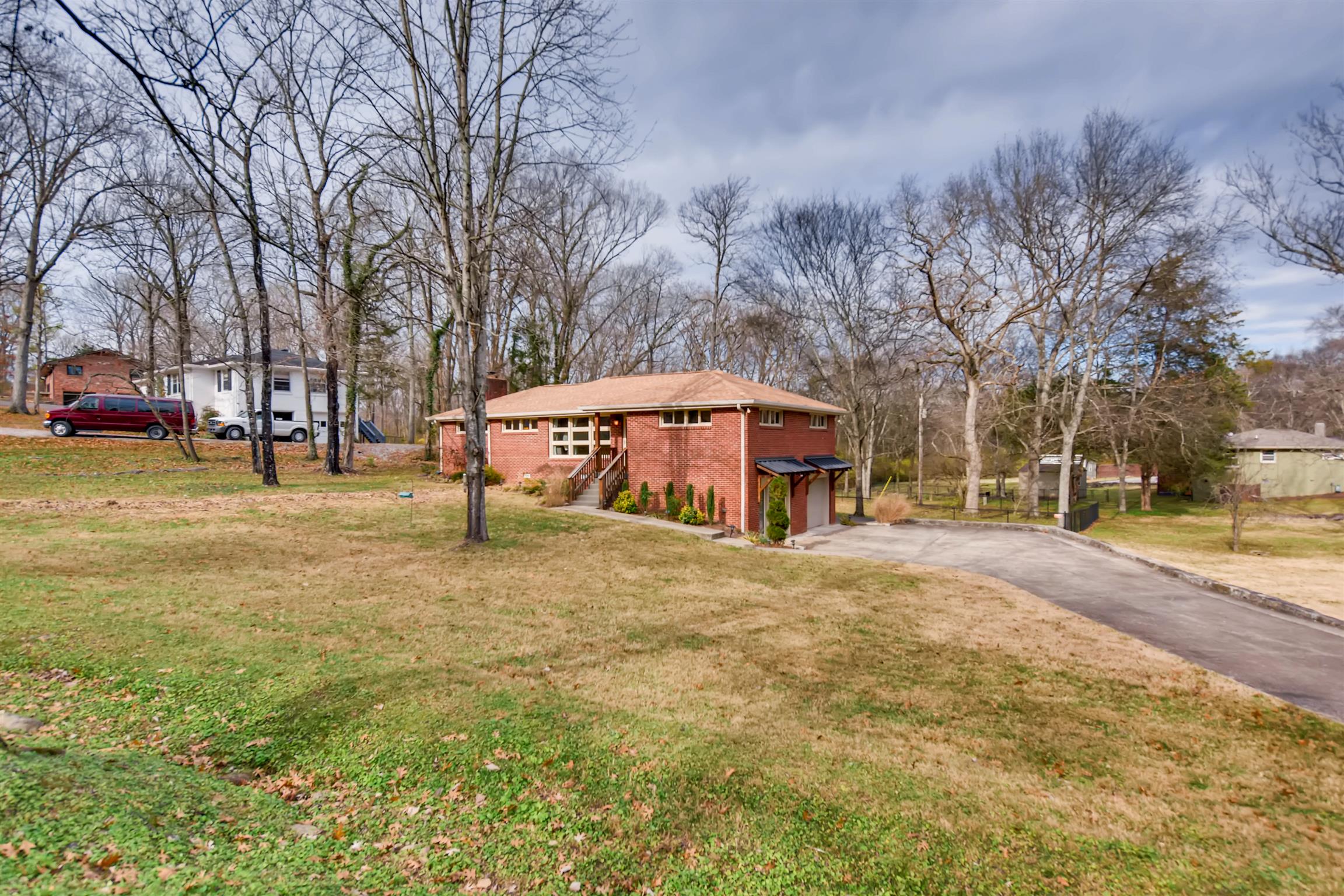 1100 Sparta Road Nashville, TN 37205 - Photo 2 of 29 a view of a house with a yard and large trees