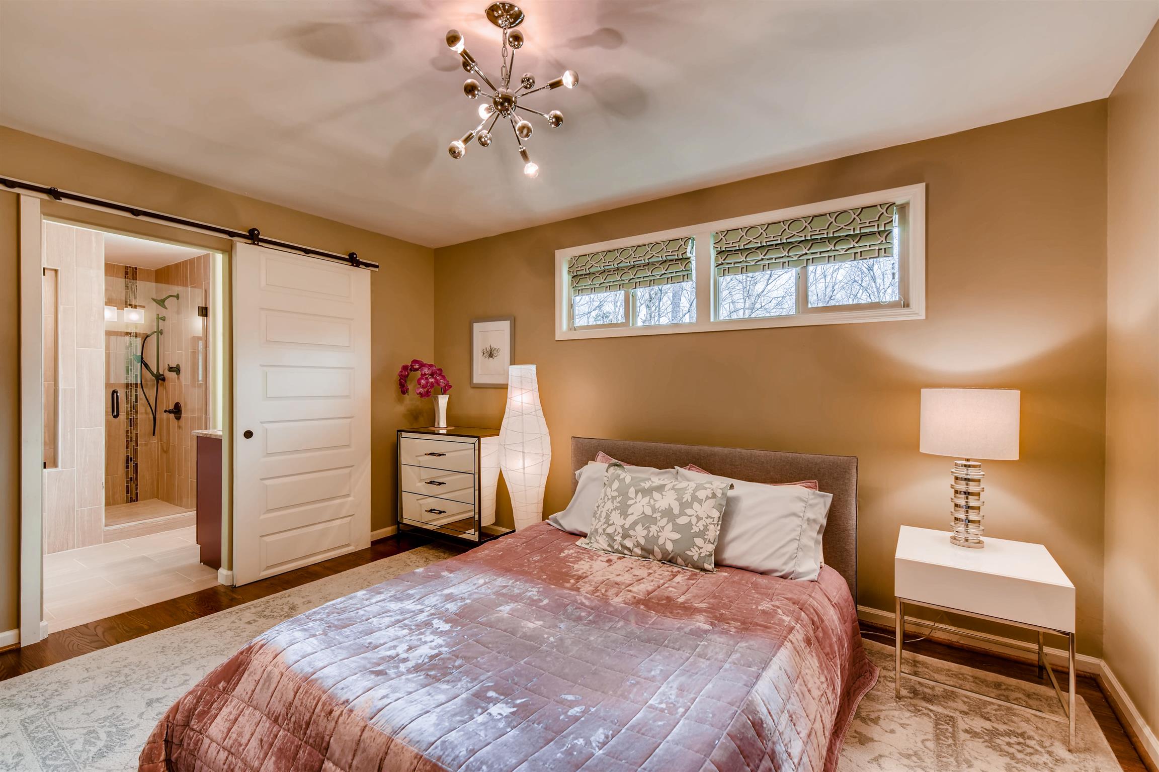 1100 Sparta Road Nashville, TN 37205 - Photo 17 of 29 a bedroom with a bed and a chandelier