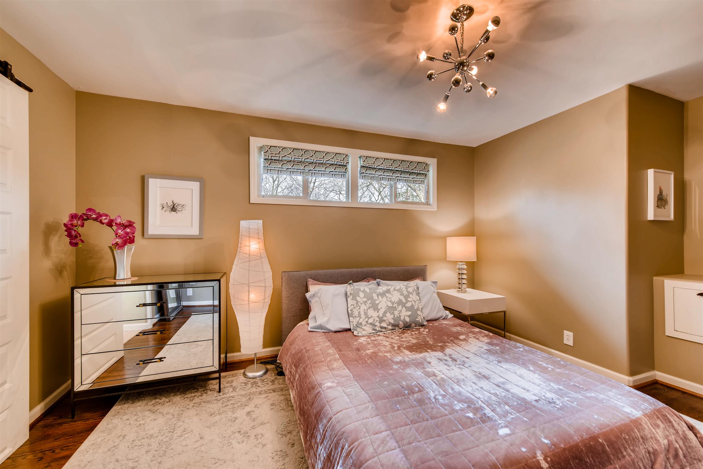 1100 Sparta Road Nashville, TN 37205 - Photo 18 of 29 a bedroom with a bed and a chandelier