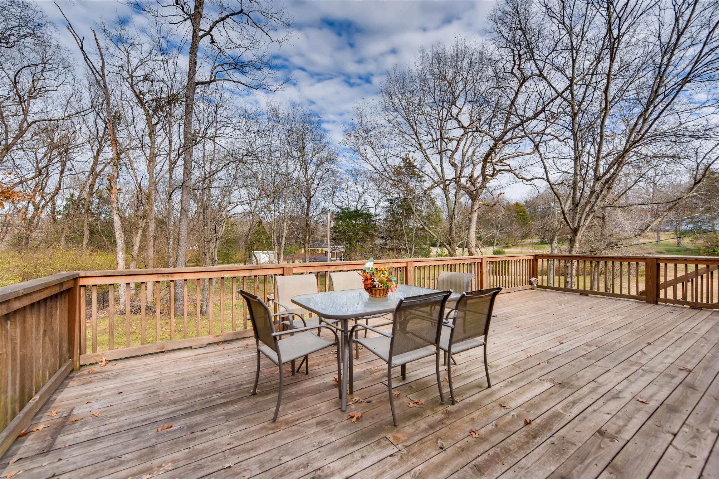 1100 Sparta Road Nashville, TN 37205 - Photo 5 of 29 a view of balcony with wooden floor and outdoor seating