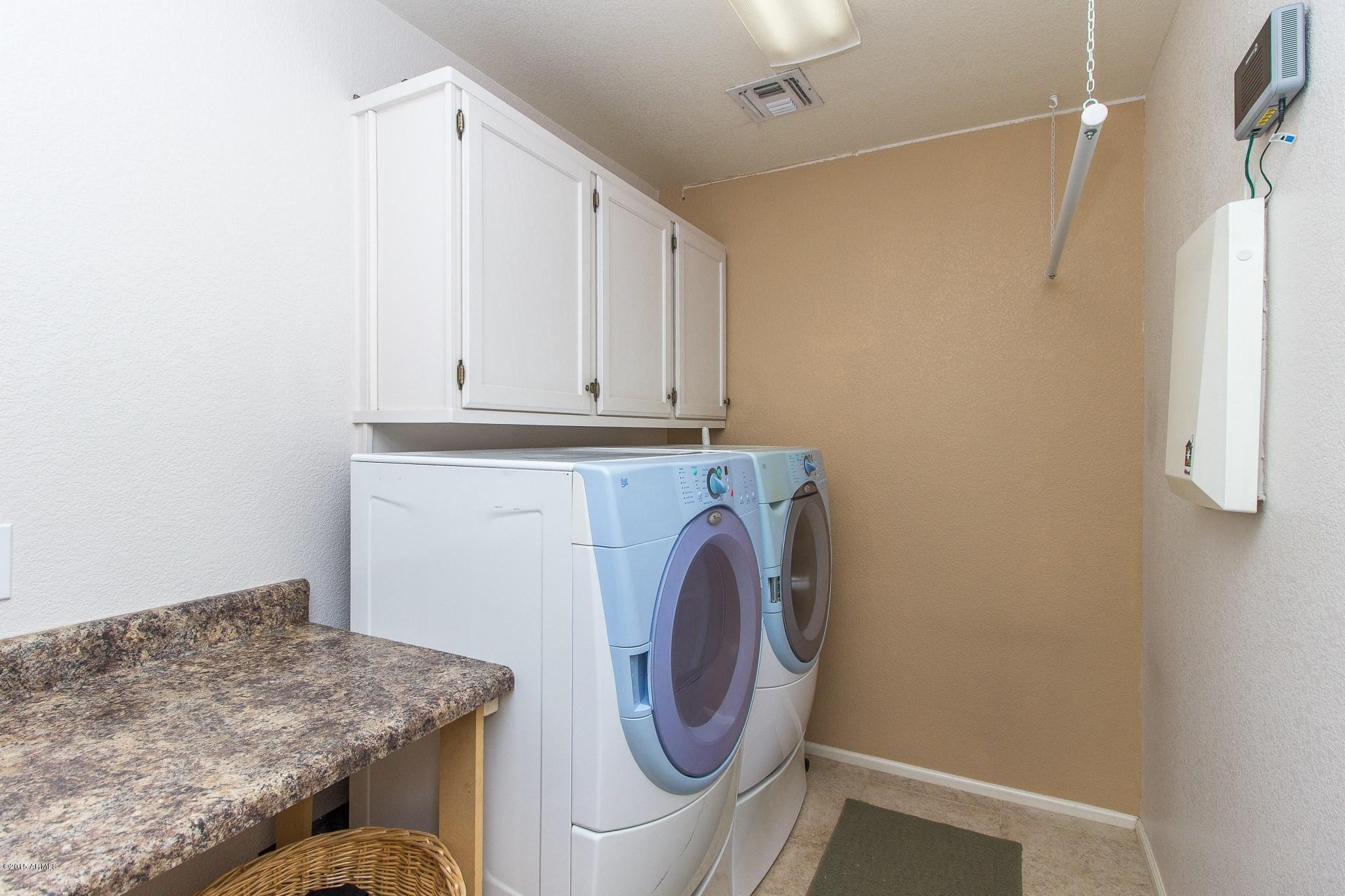 3864 East Baranca Road Gilbert, AZ 85297 - Photo 22 of 35 023_LAUNDRY ROOM OFF KITCHEN