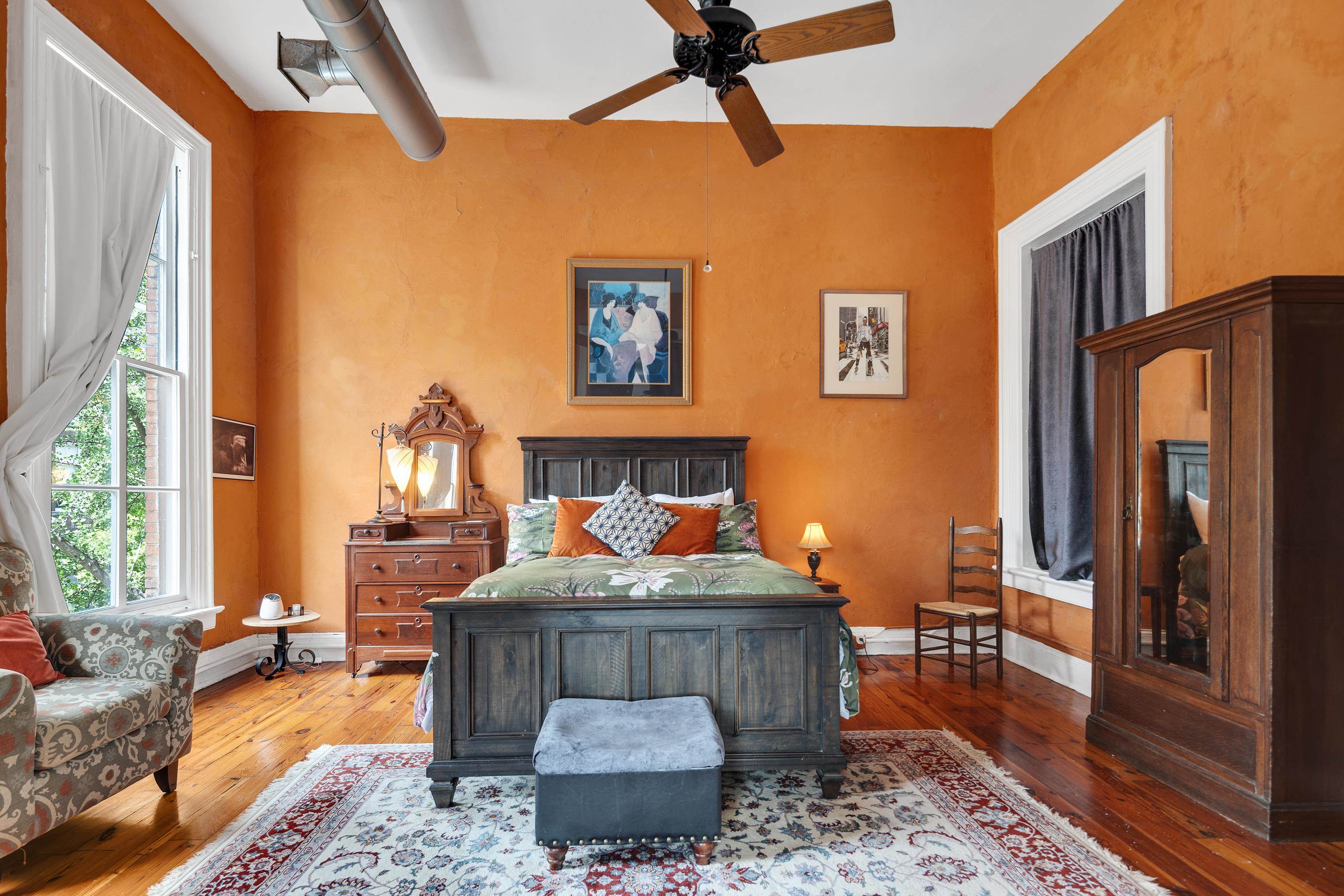 116 South Front Street, Unit 201 Memphis, TN 38103 - Photo 11 of 26 Bedroom with hardwood / wood-style floors and a ceiling fan