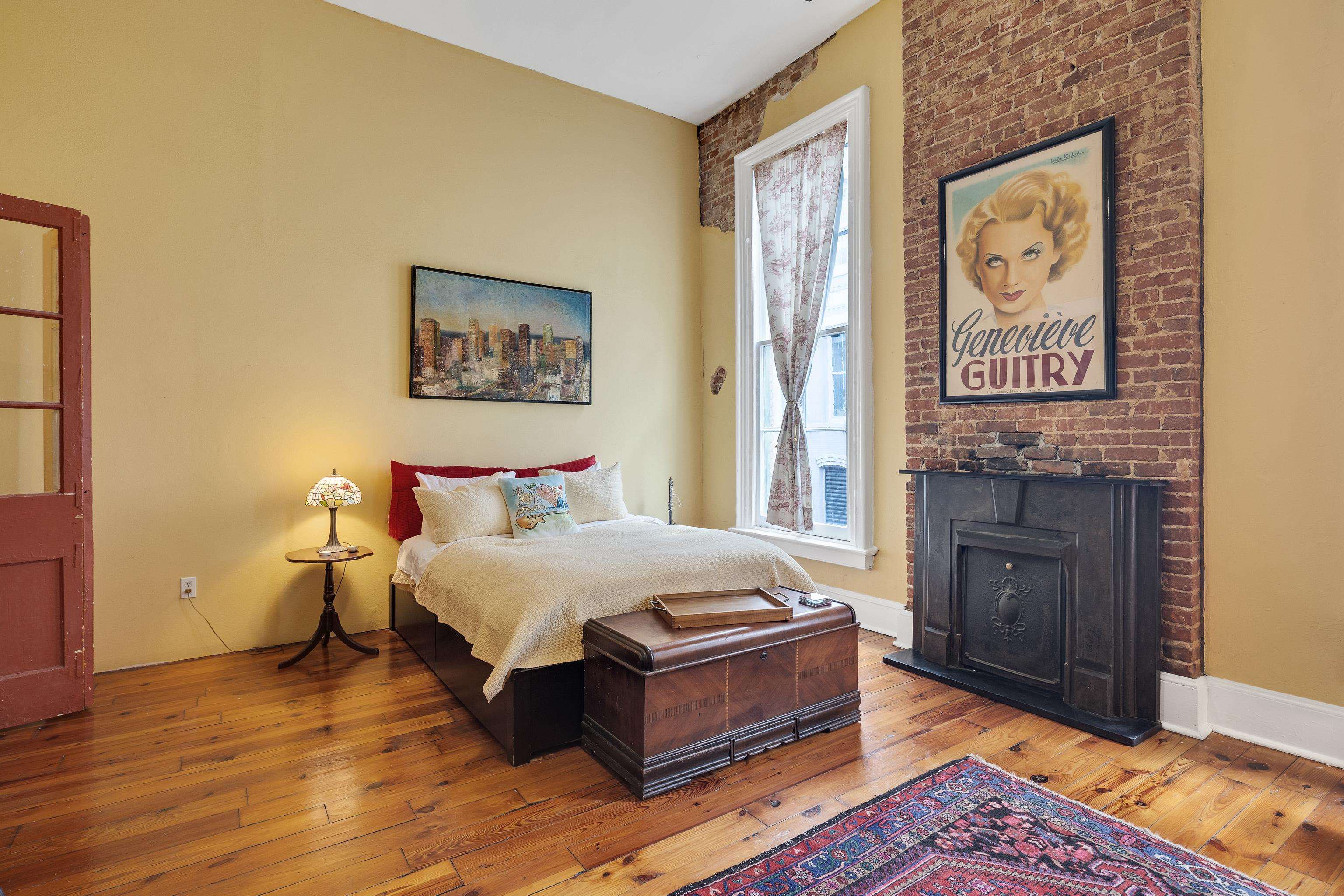 116 South Front Street, Unit 201 Memphis, TN 38103 - Photo 14 of 26 Bedroom with hardwood / wood-style floors