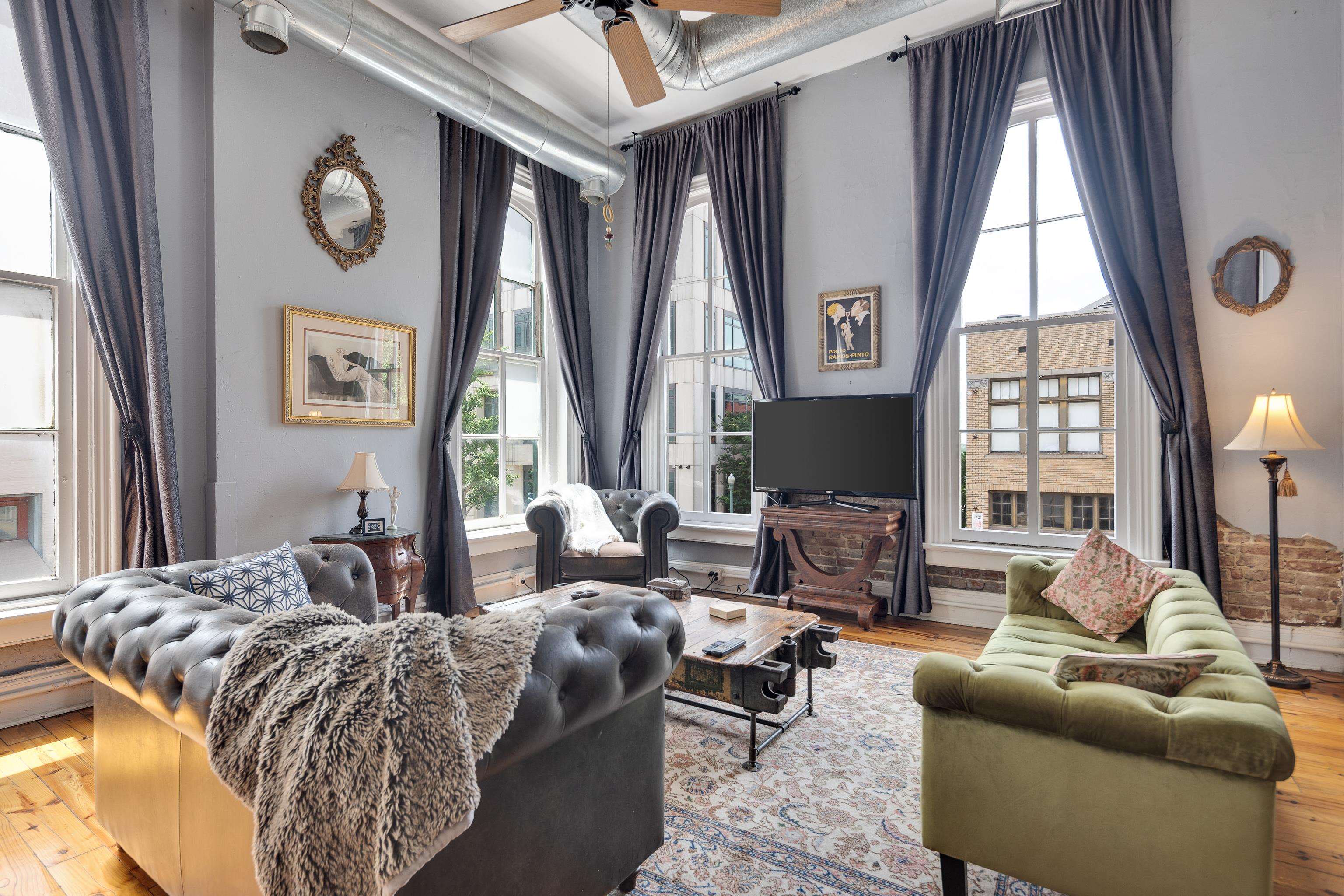 116 South Front Street, Unit 201 Memphis, TN 38103 - Photo 5 of 26 Living area with hardwood / wood-style flooring and a ceiling fan